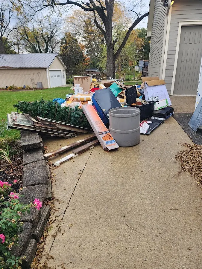 Dumpster being loaded with debris for Demolition Dumpster Rental in Edgmont